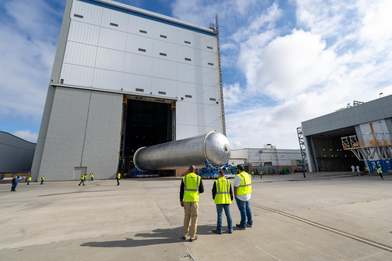 Teams move the core stage liquid hydrogen tank for the Artemis III mission to a priming cell near the Vertical Assembly Building at NASA’s Michoud Assembly Facility in New Orleans Nov. 21. Technichians will sand down and prepare the suface of the tank before coating it in a primer. Primer is applied to the barrel section of the tank by an automated robotic tool, whereas the forward and aft domes are primed manually.   Once priming is complete, technicians with NASA and Boeing, the SLS core stage prime contractor, will apply a foam-based thermal protection system, which protects the propellant tank from the extreme temperatures it will face during launch and flight while also regulating the super-chilled propellant within it. The propellant tank is one of five major elements that make up the 212-foot-tall rocket stage. The core stage, along with its four RS-25 engines, produce two million pounds of thrust to help launch NASA’s Orion spacecraft, astronauts, and supplies beyond Earth’s orbit and to the lunar surface for Artemis.   